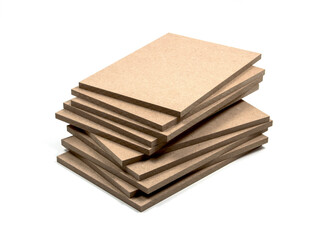 Several boards of raw mdf, irregularly stacked.