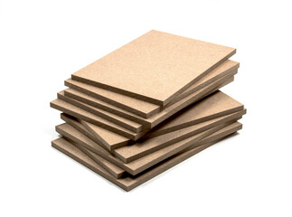 Several boards of raw mdf, irregularly stacked.