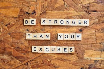 be stronger than your excuses text on wooden square, motivation quotes