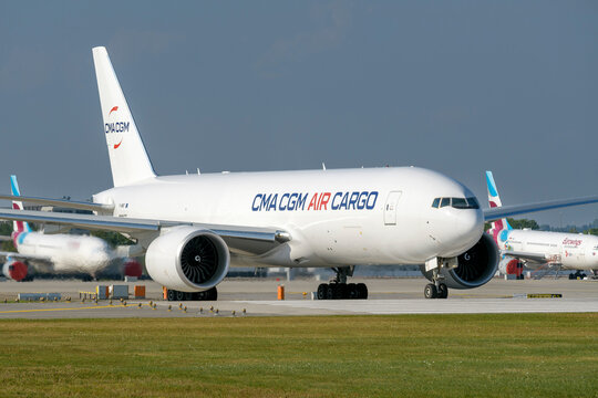 CMA CGM Air Cargo Boeing 777-F with the aircraft registration .F-HMRF is taxiing for take off on the southern runway 08R of the Munich Airport MUC EDDM