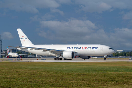 CMA CGM Air Cargo Boeing 777-F with the aircraft registration .F-HMRF is taxiing for take off on the southern runway 08R of the Munich Airport MUC EDDM
