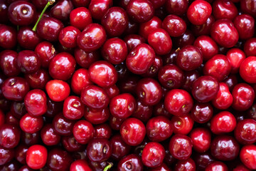Cherry background. Cherry top view. Sour cherry flat design. Fruit macro.