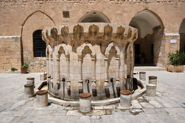 lavatory made of limestone in mosque in Mardin. Ancient mardin ablution room for muslim for...