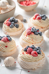 Homemade and tasty Pavlova dessert made of mascarpone and berries.