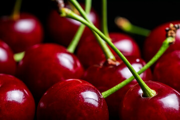 Red ripe fresh cherries in drops of water close up. Cherry background. Berry pattern and texture. Food background.