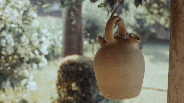 botijo in the sun on a white background