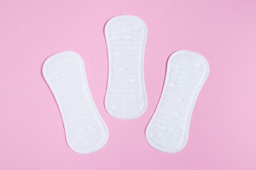 Daily women's gasket on pink background. Woman hygiene protection