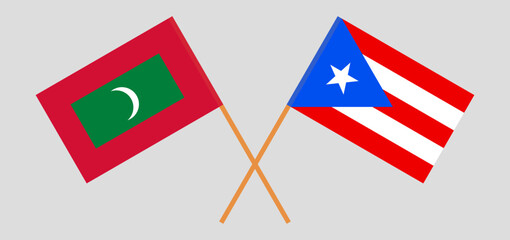 Crossed flags of Maldives and Puerto Rico. Official colors. Correct proportion