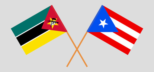 Crossed flags of Mozambique and Puerto Rico. Official colors. Correct proportion