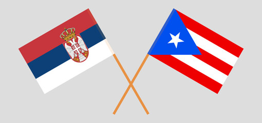Crossed flags of Serbia and Puerto Rico. Official colors. Correct proportion