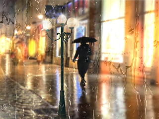 Rain in city , street lamp and lantern evening light,pedestrian with umbrellas ,autumn evening , rainy drops on wet pavement ,people walk in old town of Tallinn