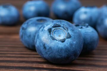 Fresh Blueberries on wooden background close up