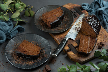 Chocolate cake cut with a beautiful knife, food photography.