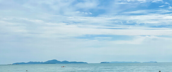 Blue skies on the beach by the sea in a local attraction