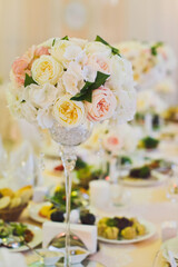 Bouquet of flowers in vase on the wedding table