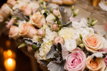 Bouquet of flowers in vase on the wedding table