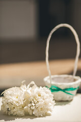 White flowers on the wedding table near the basket
