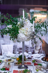 Bouquet of flowers in vase on the wedding table