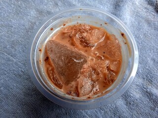 Top view coffee ice on a plastic cup