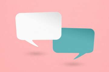 Conceptual image about communication and social media, two blank white and blue speech bubble paper...