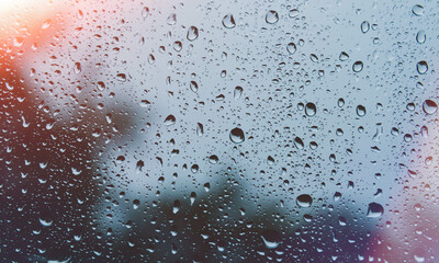 Sun after rain. Drops on glass. It's been raining. Texture on glass.