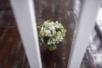 Wedding bouquet stands on the vintage floor