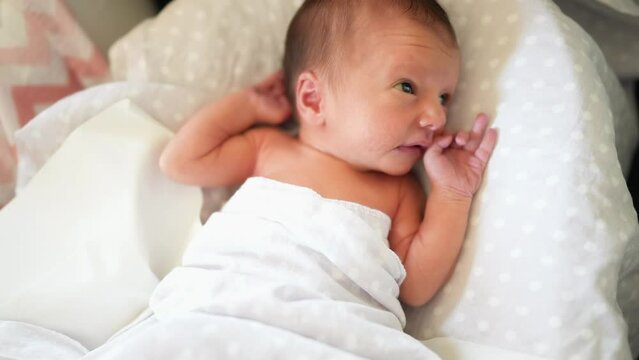 baby newborn. little baby a newborn 1 month of life lies in bed in the maternity hospital. happy family kid dream concept. close-up baby indoors lifestyle. beautiful cute girl lies at home