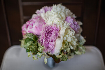 Colorful wedding bouquet on a vintage chair