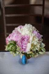 Colorful wedding bouquet on a vintage chair