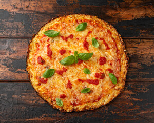 Cauliflower crust pizza with tomato sauce, cheese and basil. Healthy diet food