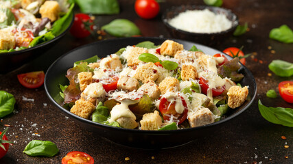 Vegetarian ceasar salad with meat free chicken pieces cherry tomatoes croutons and lettuce