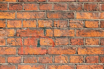 bright old red orange brick wall. rough surface texture
