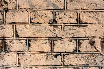 bright old beige red brick wall. rough surface texture