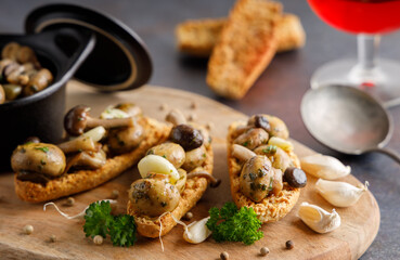 Mushrooms in garlic butter sauce. Mushrooms prepared with garlic , fresh butter and parsley served as a appetizer.