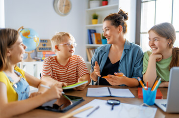 Happy kids and teacher at school