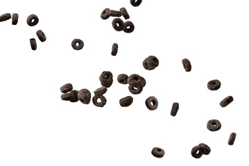 Chocolate rings cereal spill out into a bowl. Breakfast.