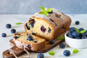Blueberry cake on white background. Homemade sweet baking.