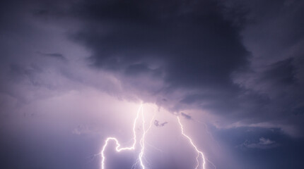 Fork lightning striking down during summer storm