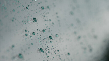 rain drops beading on hydrophobic car glass