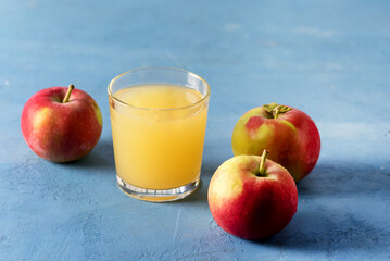 Glass of Tasty Apple Juice with Pulp Red Apples Blue Background Horizontal Harvest Autumn