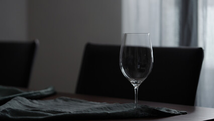 Empty wine glass on table indoor with copy space
