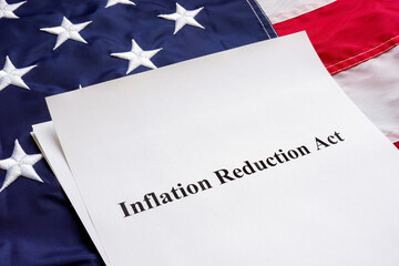 Papers with the Inflation Reduction Act and US flag. - obrazy, fototapety, plakaty