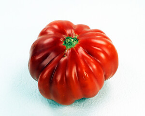 Tomato isolated on white. Ripe red fresh appetizing tomato. Harvest vegetables, Spanish tomatoes. Raf variety, organic vegetables