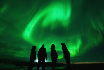 Northern lights over group of friends in Iceland