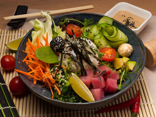 a traditional Hawaiian poke dish with tuna and sauce. close-up