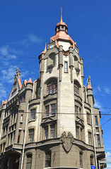 Fototapeta premium House of city institutions (1904-1906), house with high tower and coat of arms of St. Petersburg on corner of Sadovaya Street and Voznesensky Prospekt