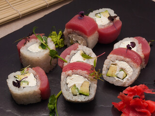 sushi rolls with tuna, cucumber, avocado and cream cheese