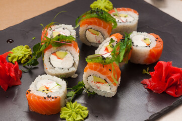 sushi rolls with salmon, crab, avocado and cream cheese