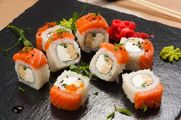 sushi rolls with salmon, Japanese omelette, cream cheese and green onions