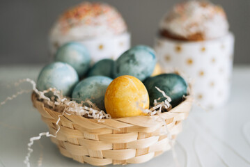 Easter cakes, eggs and the letters Christ is Risen on the table. Orthodox Christians.